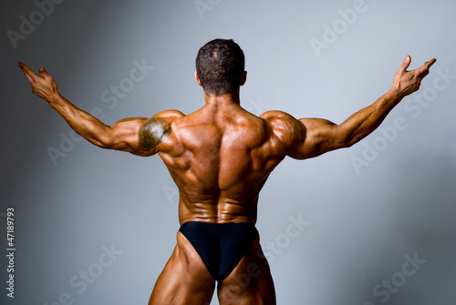 Photo: Young bodybuilder showing his biceps Young bodybuilder showing his biceps