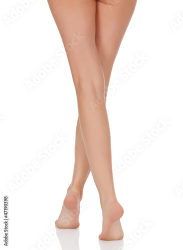 Photo: Female legs with pink heels isolated on white background Female legs with pink heels isolated on white background