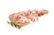 Foto: slices of italian raw ham on wooden board slices of italian raw ham on wooden board