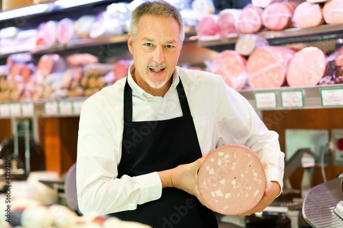 Photo: Butcher serving a customer Butcher serving a customer