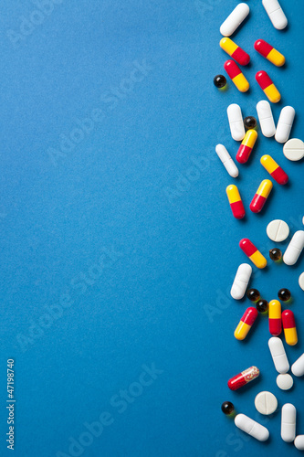 Photo: pills border over blue pills border over blue