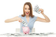 Photo: Woman with piggy bank and dollar bills Woman with piggy bank and dollar bills