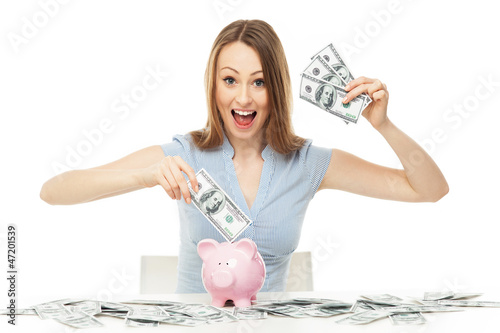 Photo: Woman with piggy bank and dollar bills Woman with piggy bank and dollar bills