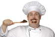 Foto: Cocinero chef probando crema de chocolate. Cocinero chef probando crema de chocolate.
