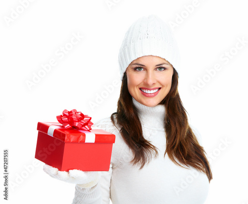 Photo: Beautiful young Christmas girl with gift. Beautiful young Christmas girl with gift.