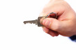 Photo: Hand with a house key. Hand with a house key.