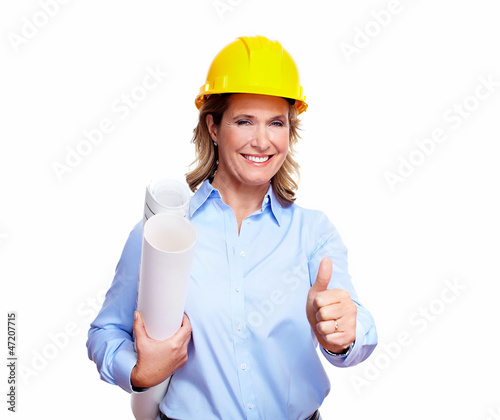 Photo: Architect woman with a plan. Architect woman with a plan.