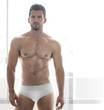 Sexy young male muscular model in white underwear