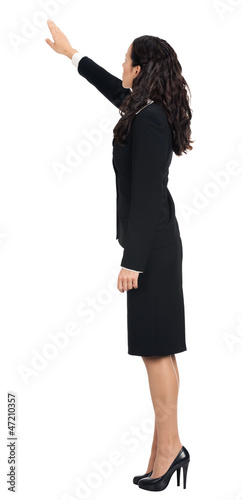 Photo: Full body of business woman pointing, isolated Full body of business woman pointing, isolated