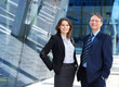 A couple of young business persons in formal clothes