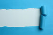 Photo: Torn Blue Paper Torn Blue Paper