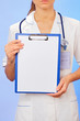 Doctor with copyspaced clipboard waist-high portrait on blue