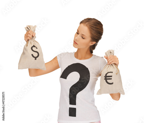 Photo: woman with dollar and euro signed bags woman with dollar and euro signed bags