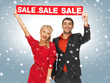 man and woman with sale sign