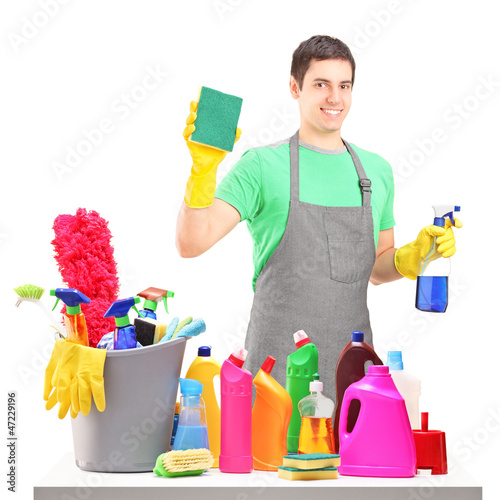 Photo: A smiling male cleaner with cleaning equipment A smiling male cleaner with cleaning equipment