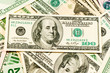 American dollar bills scattered in a chaotic manner