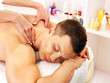 Man getting massage in spa.
