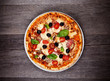 Delicious italian pizza served on wooden table