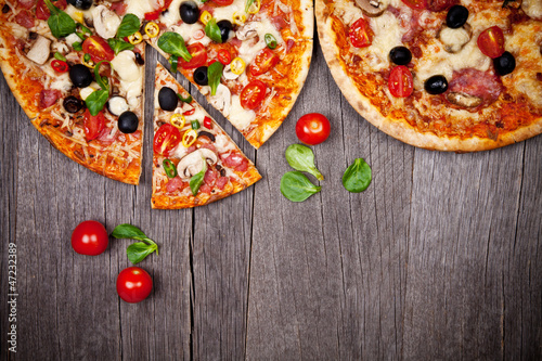  Delicious italian pizzas served on wooden table