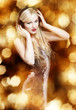 Sexy blond woman on golden background