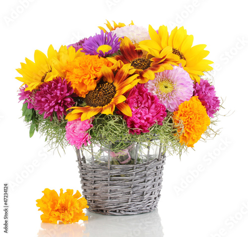 Photo: Beautiful bouquet of bright flowers isolated on white Beautiful bouquet of bright flowers isolated on white