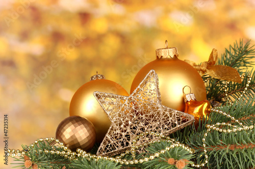 Photo: Christmas decoration on yellow background Christmas decoration on yellow background
