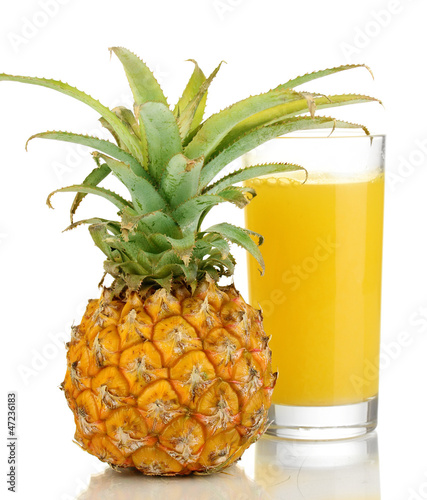 Photo: Ripe pineapple and juice glass isolated on white Ripe pineapple and juice glass isolated on white