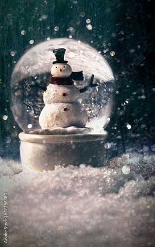 Photo: Snow globe in a snowy winter setting Snow globe in a snowy winter setting