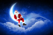 photo of santa claus sitting on the moon