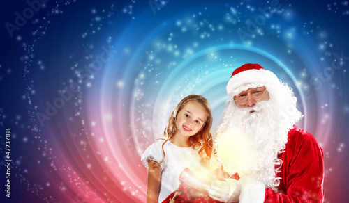 Photo: portrait of santa claus with a girl portrait of santa claus with a girl
