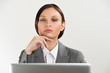 Adult business woman sitting at her office and working with lapt