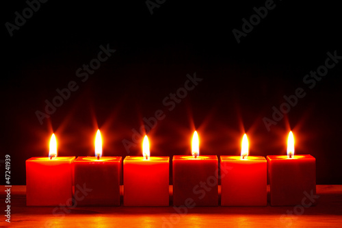 Photo: Six square candles burning bright Six square candles burning bright