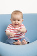 baby playing at eating his feet