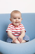 baby playing at eating his feet
