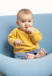 baby playing at eating his feet