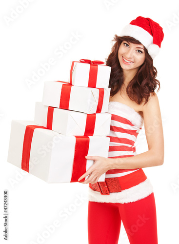 Photo: Happy santa woman with gift boxes Happy santa woman with gift boxes