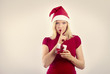 beautiful blonde woman holding a christmas gift is smiling