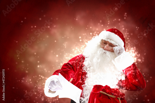 Photo: Santa with christmas letter Santa with christmas letter