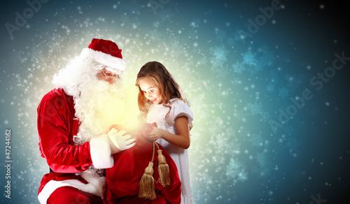Photo: portrait of santa claus with a girl portrait of santa claus with a girl