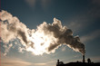 Smoke from an industrial chimney obscuring the sun