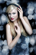 Blonde woman dancing with headphones