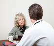 Mature Woman Talking with Her Doctor
