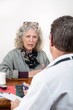 Worried Woman Talking with Her Doctor