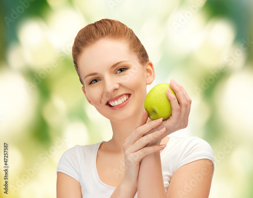 Photo: young beautiful woman with green apple young beautiful woman with green apple
