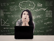 Girl with laptop is nervous facing exam