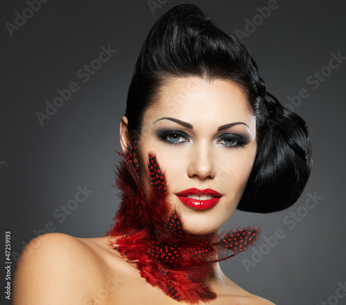 Photo: Fashion woman with beauty hairstyle and style makeup Fashion woman with beauty hairstyle and style makeup
