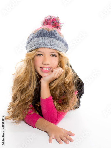 Photo: Kid girl with winter wool cap smiling on white Kid girl with winter wool cap smiling on white