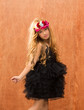 black dress kid girl dancing on vintage background
