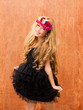 black dress kid girl dancing on vintage background