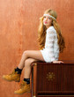 Blond children girl retro 70s with vintage furniture